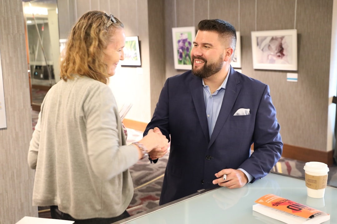 Business owner welcoming a new customer with a handshake